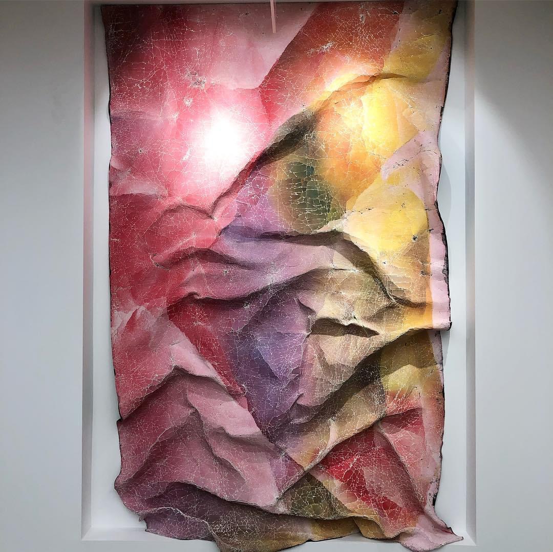 hanging art with intense folds and cracks